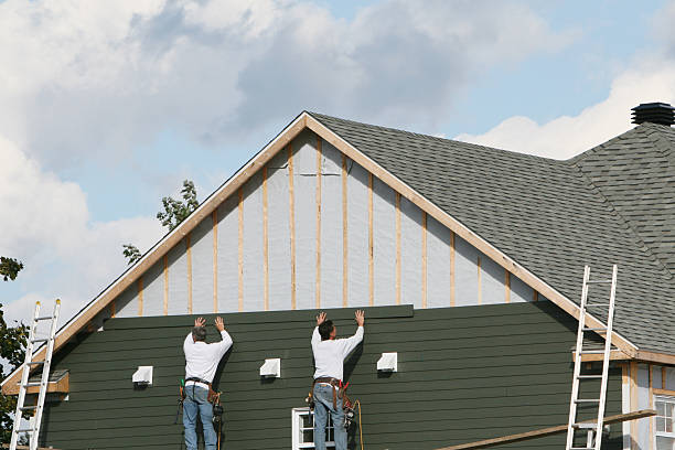 Professional Siding technician working in Eure, NC